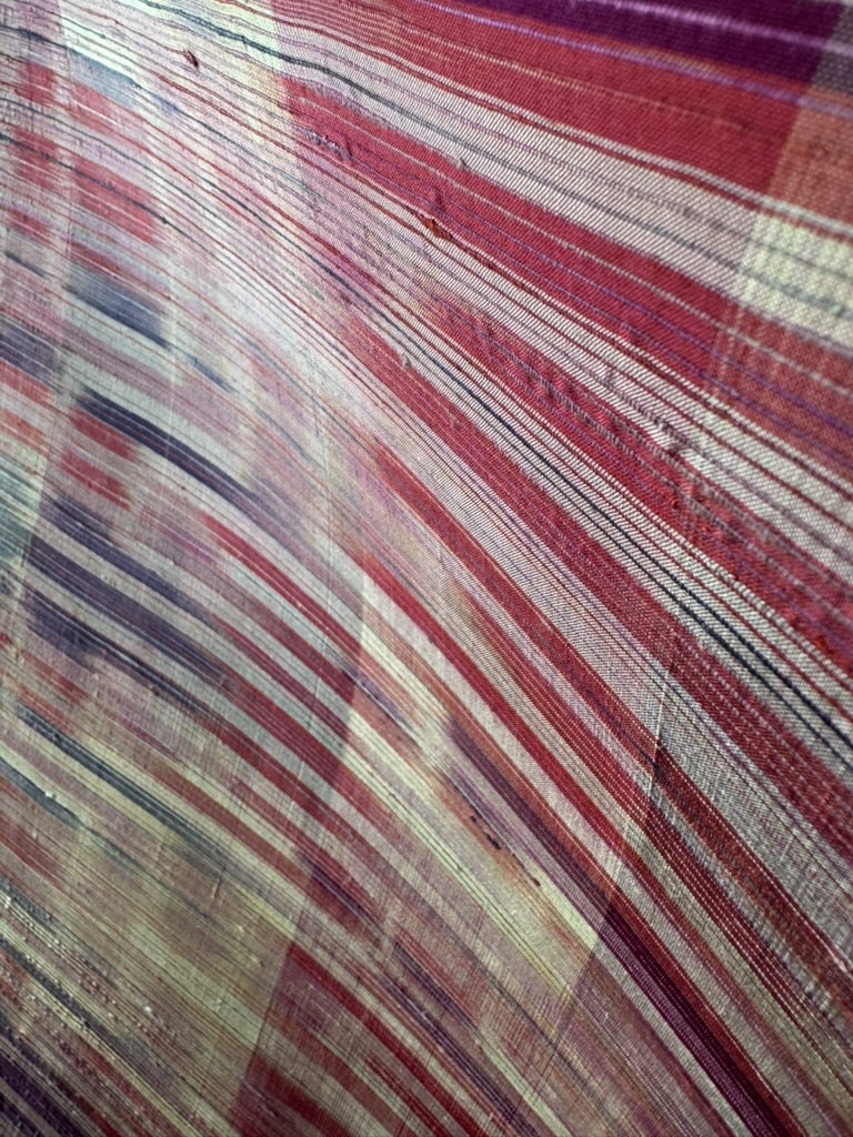 Loom Thai silk in crimson and natural tones, close detail