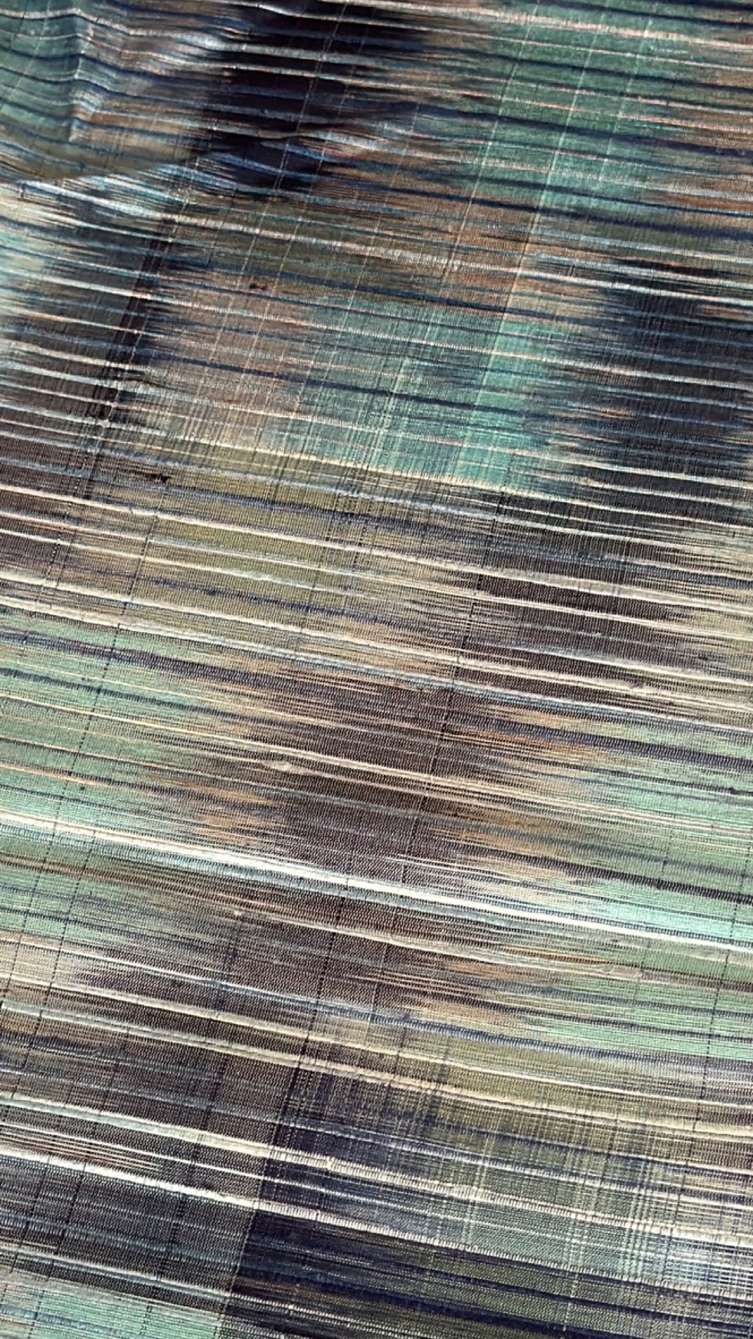 Fine textile wallcovering in mineral blue and bronze tones